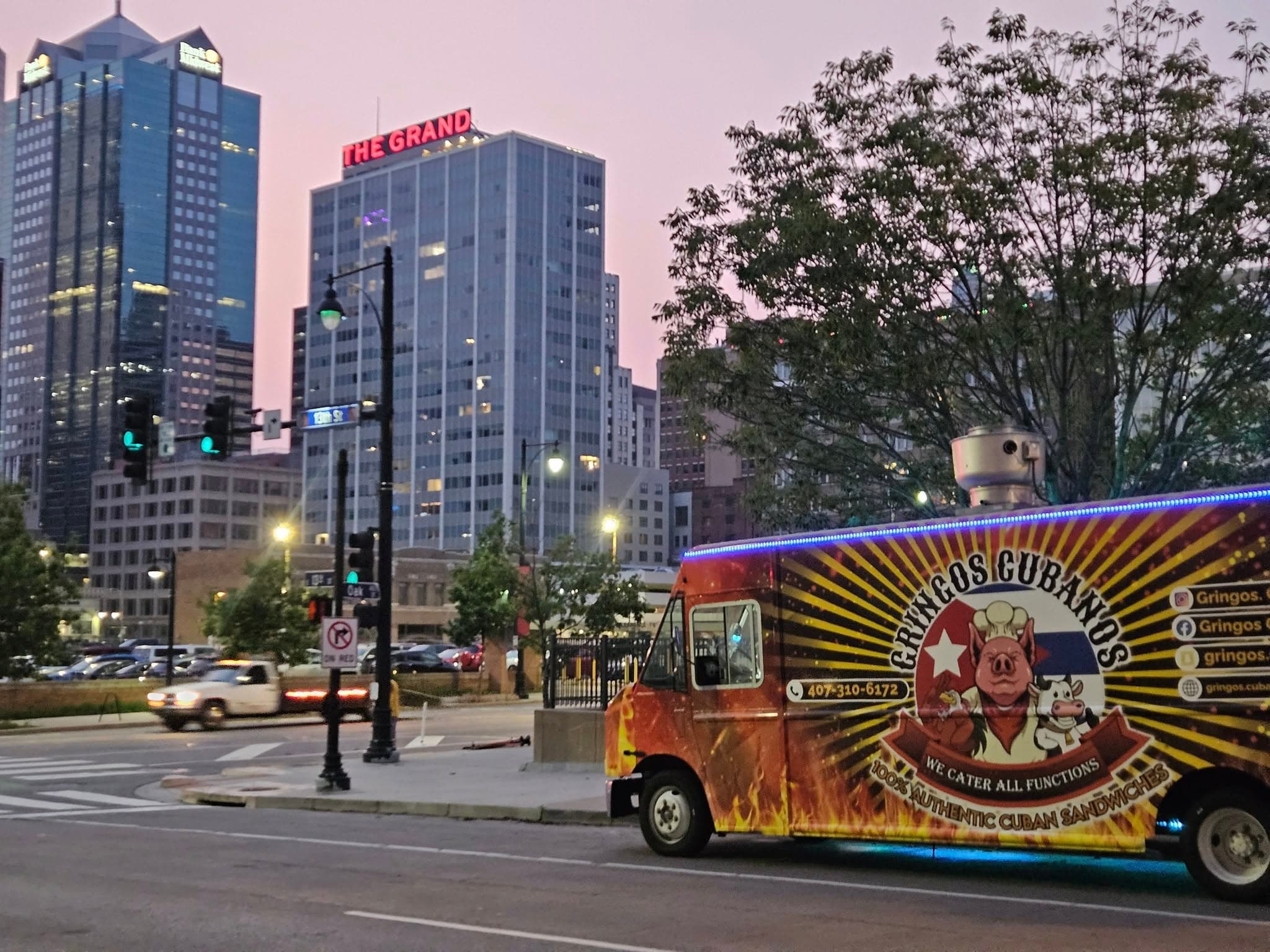 Gringos Cubanos food truck with Kansas City skyline at dusk